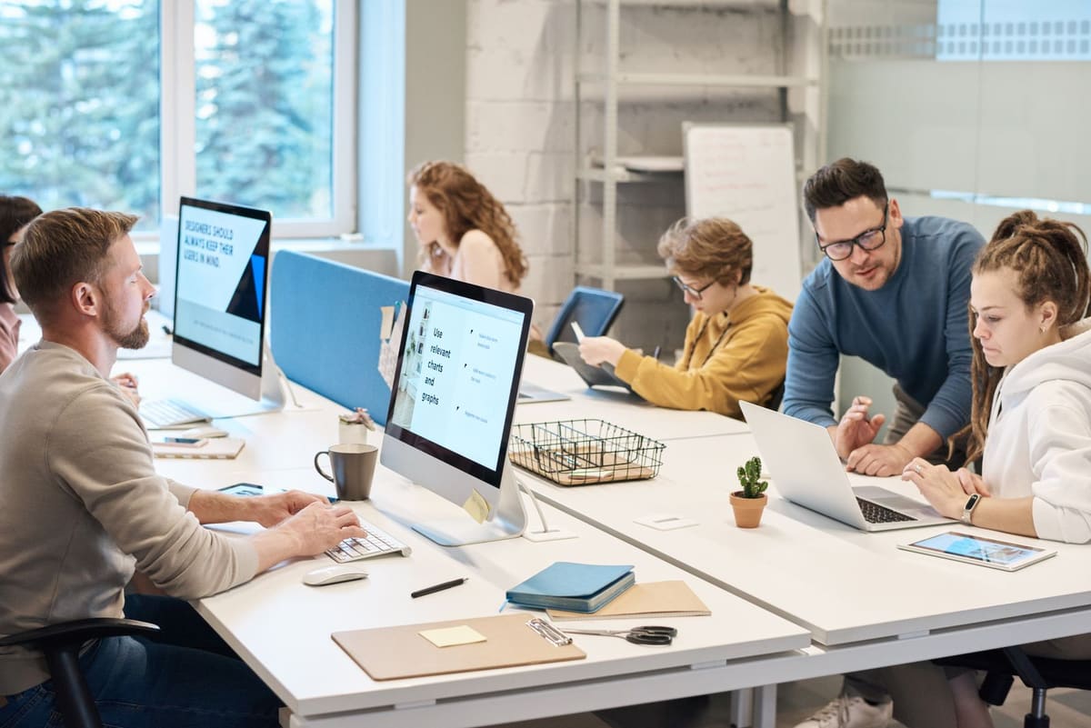 A team working together at desks in a bright modern office